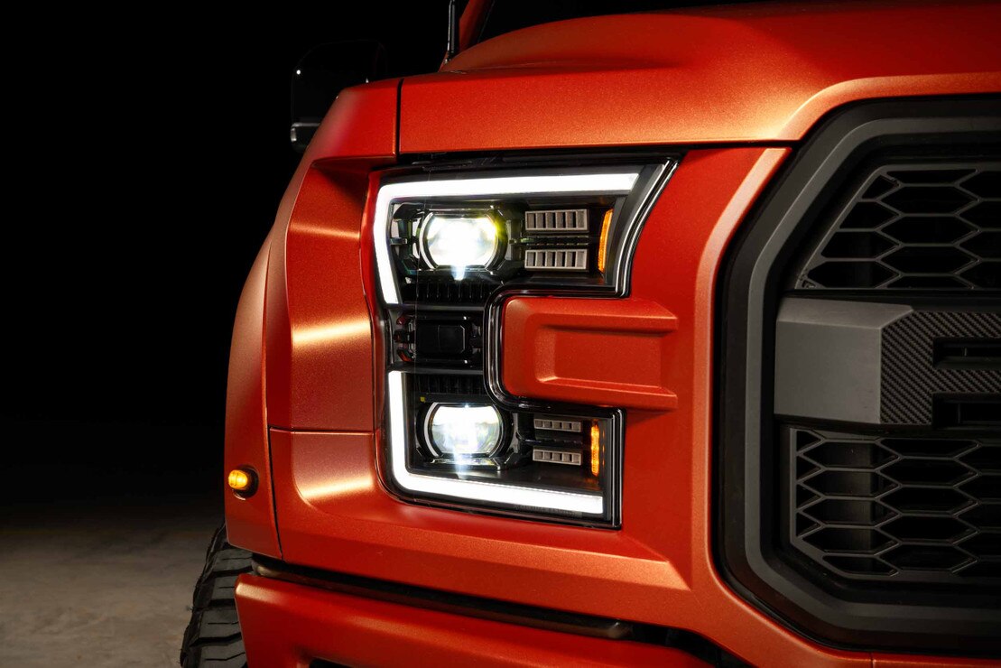 Morimoto XB Evo Hybrid LF2-502Y headlights installed on Ford F-150/Raptor with white DRLs illuminated