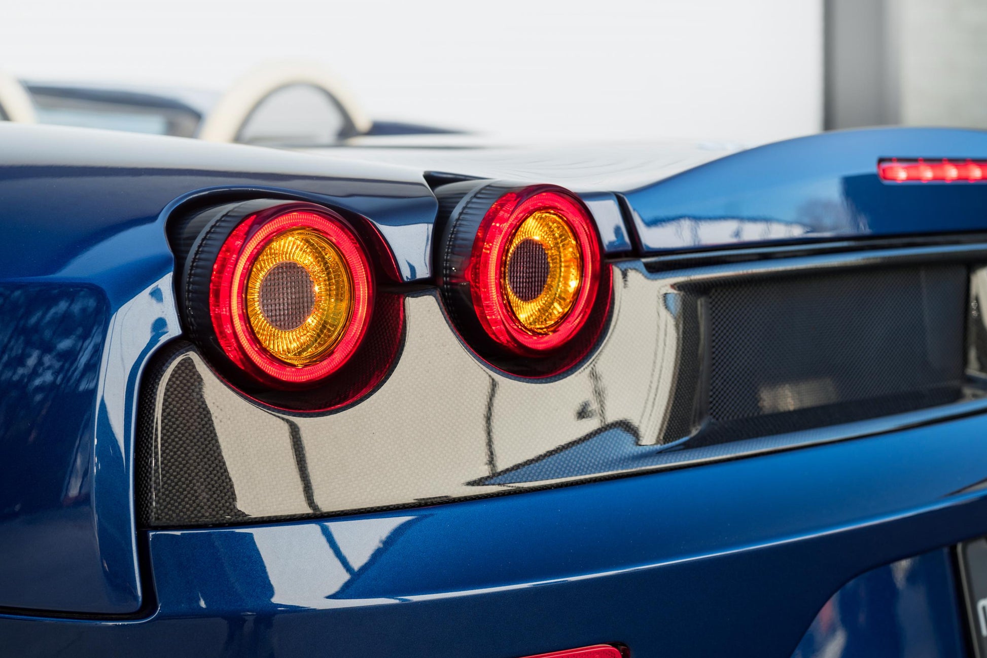 Morimoto LF357 smoked XB LED tail lights for 2005-2010 Ferrari F430 installed showing turn signal lights