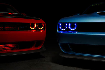 Morimoto XRGB LF495 headlights installed on Dodge Challenger with blue RGB DRLs front three-quarter view