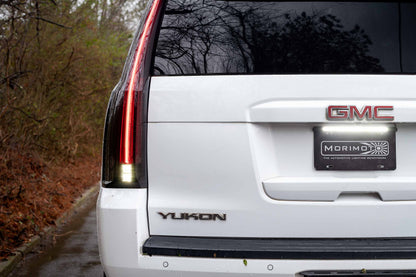 Morimoto LF766 smoked LED tail lights for 2015-2020 GMC Yukon with sequential turn signals image shows reverse lights