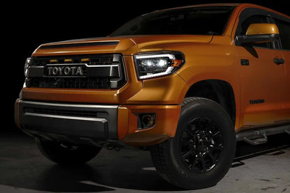 Orange Toyota truck on a dark background