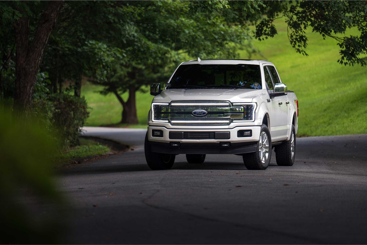 Morimoto XBG17 chrome LED grille with white DRL for 2018-2020 Ford F-150 installed on truck with lights on