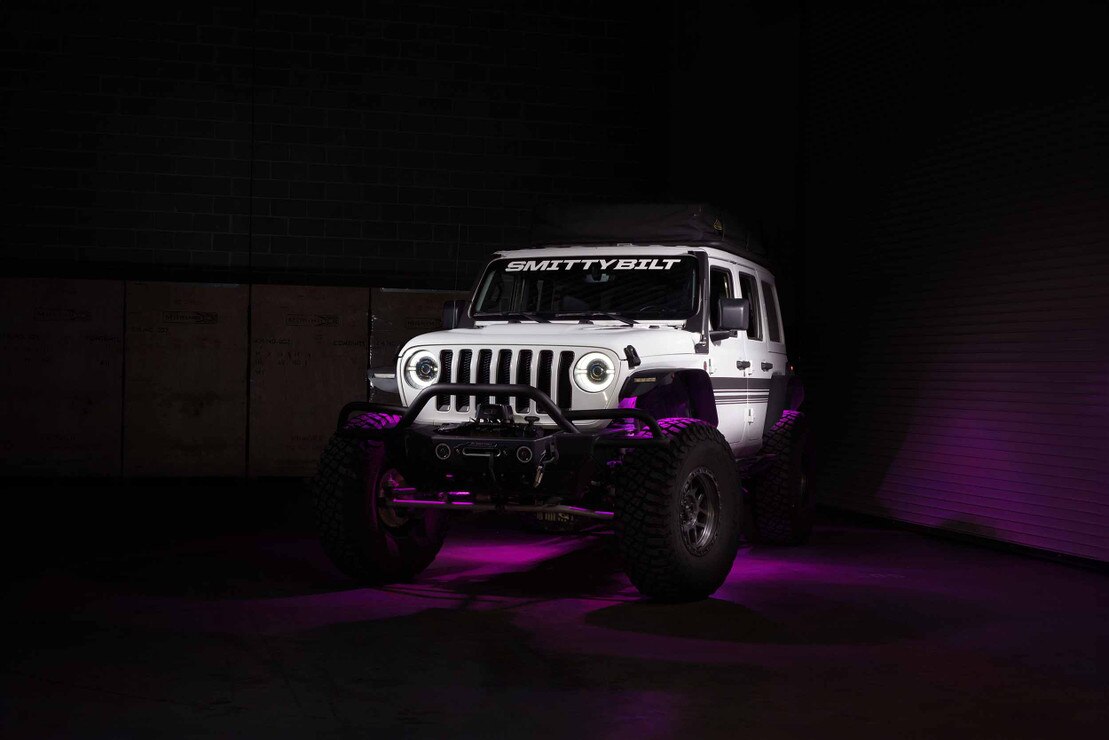 Morimoto XRL25 RGB rock light kit 6 piece Bluetooth color changing LED for trucks jeeps SUVs installed on jeep with pink colored light