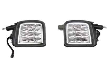 Two car fog lights with clear lenses on a white background