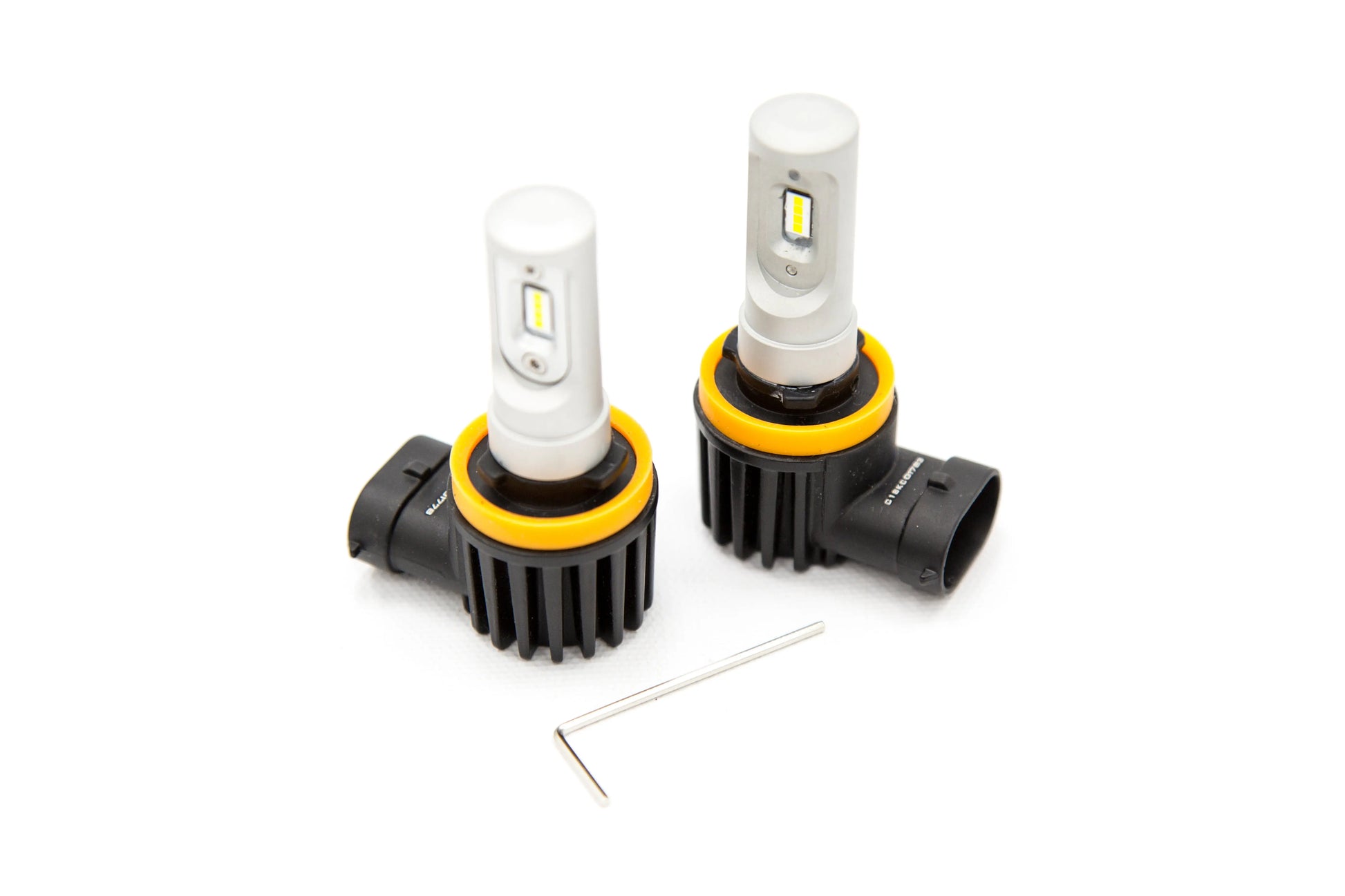 Two car headlight bulbs with yellow accents on a white background