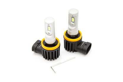 Two car headlight bulbs with yellow accents on a white background