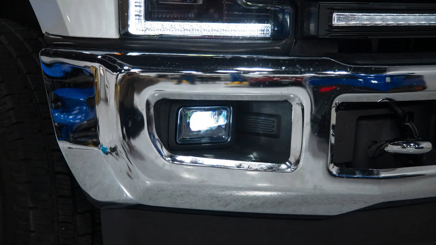 Close-up of a vehicle's chrome bumper and headlight
