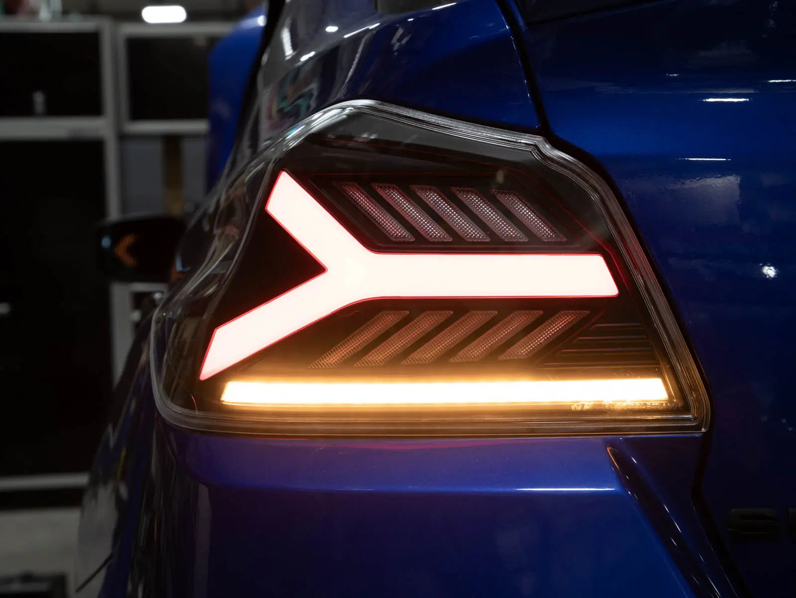 Close-up of a car's taillight with a blurred background