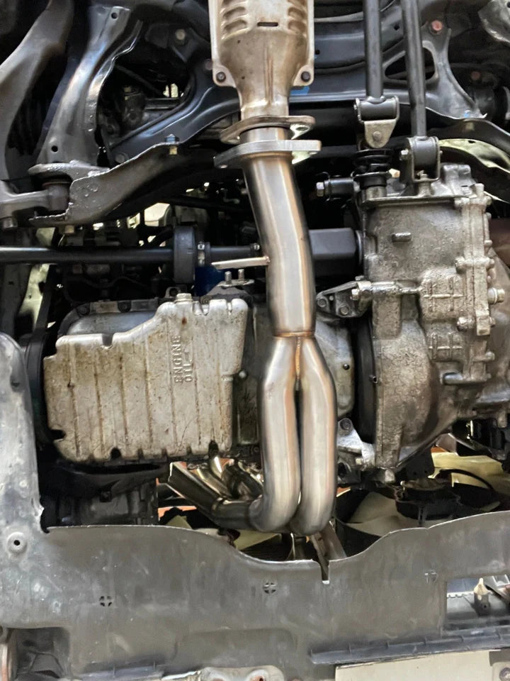PLM Power Driven D-Series Tri-Y Header for Honda Civic CRX and Del Sol D16 D15 shown under connected to catalytic convertor with exntension flange
