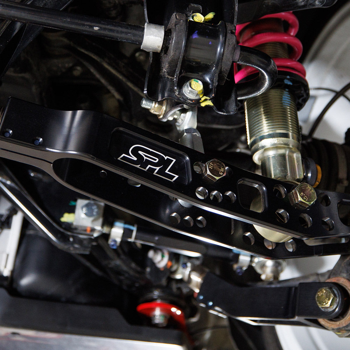 SPL Parts rear eccentric lockout kit for Toyota GR86, Subaru BRZ, WRX, and FR-S, designed to eliminate OEM eccentric bolt slip and lock down rear alignment