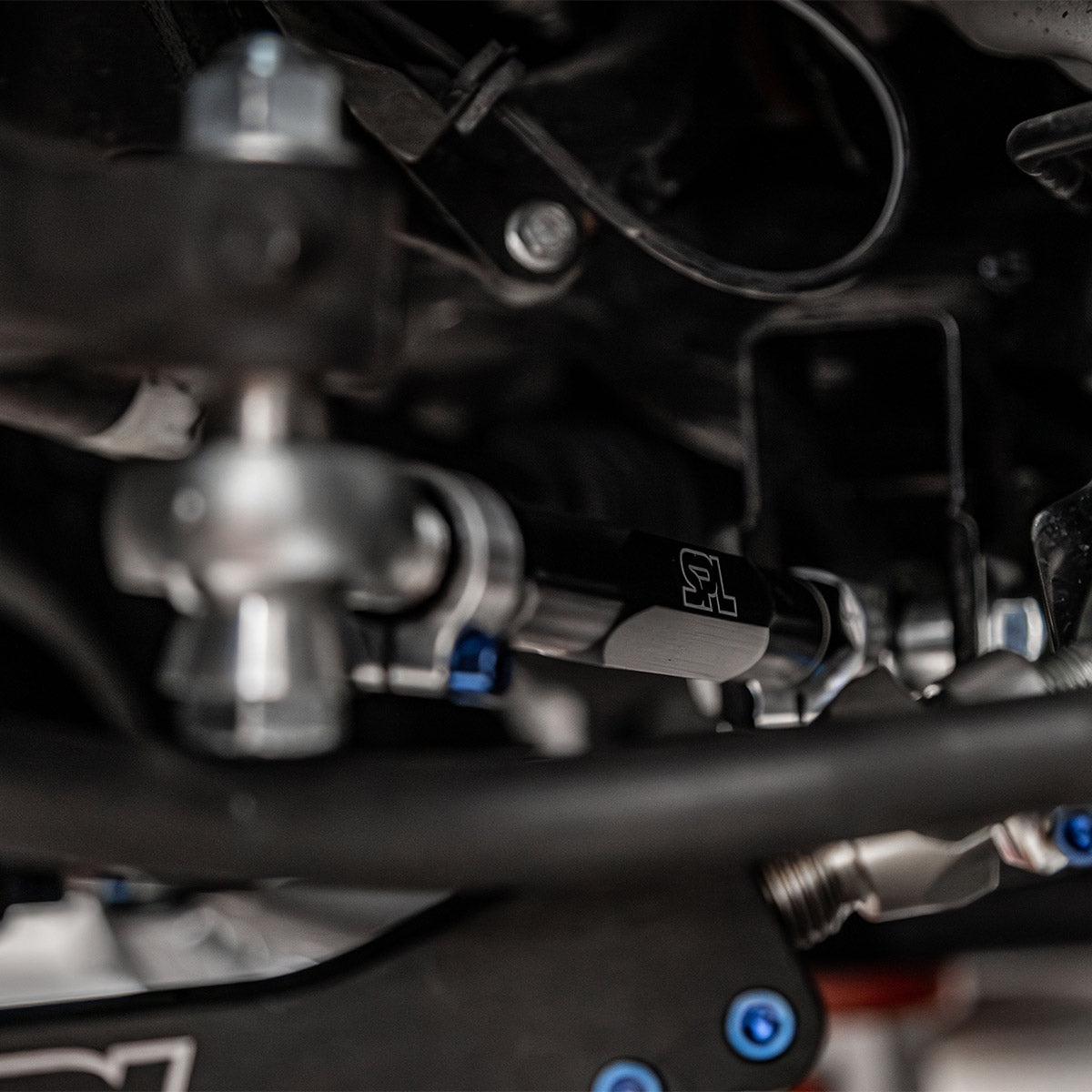 SPL RTAEL FRS adjustable rear toe arms with eccentric lockout for GR86, BRZ, WRX, and FR-S, designed to lock alignment and improve rear stability