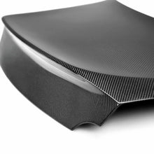 Load image into Gallery viewer, Overhead shot of the Seibon C-Style Carbon Fiber Trunk Lid on a GT-R, showcasing its seamless fitment and sporty design.