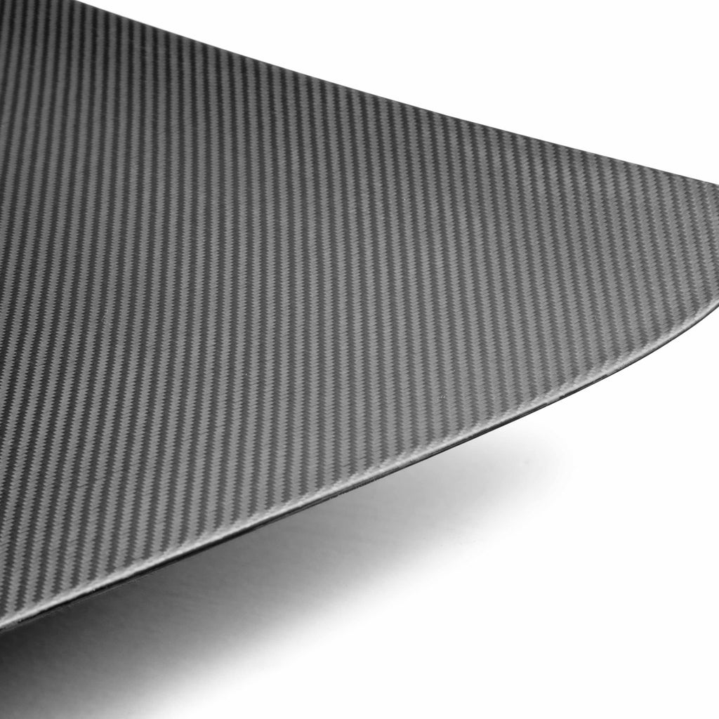 Detailed image of the dry carbon fiber texture on the Seibon TL0910NSGTR-OE-DRY trunk lid, showcasing its high-performance craftsmanship.