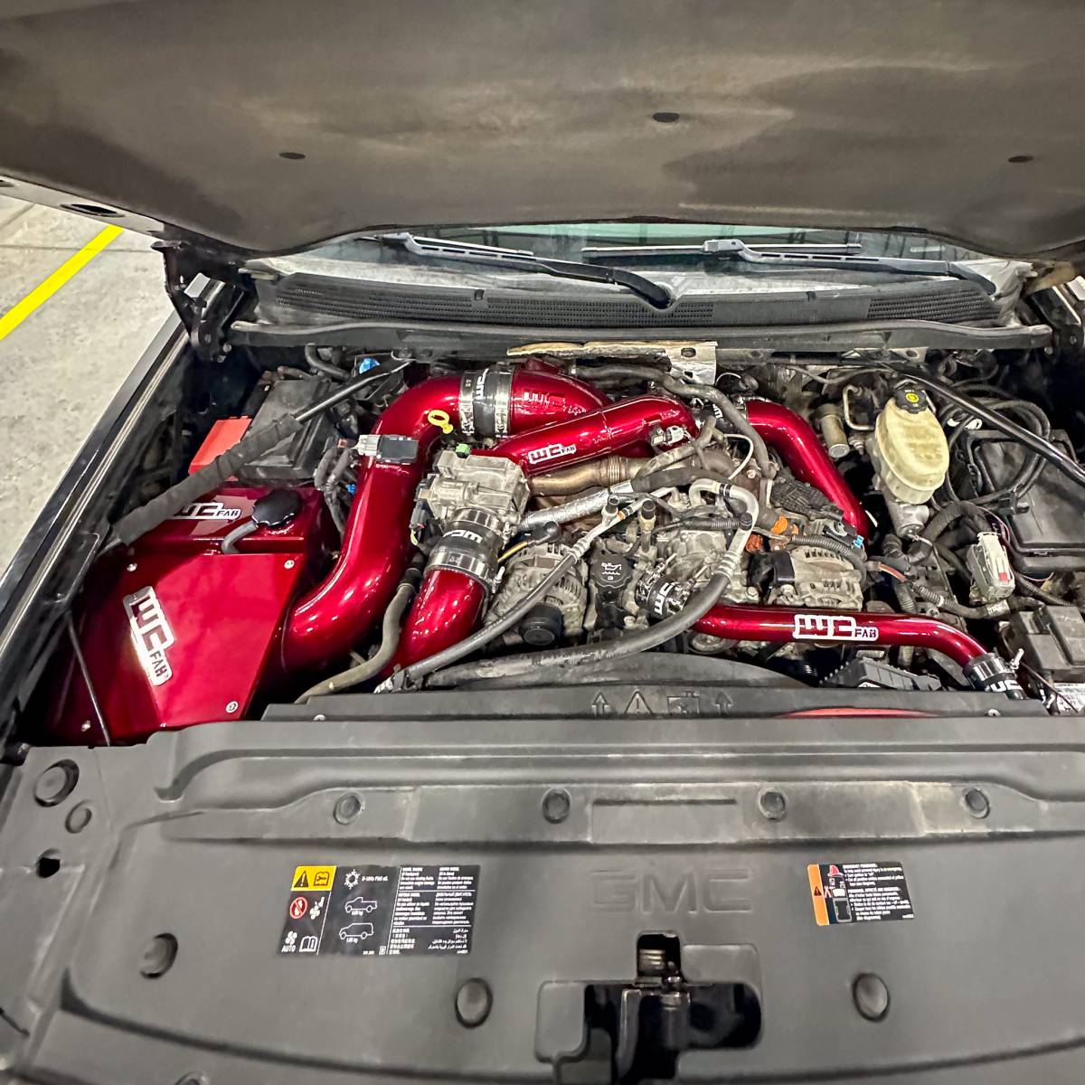 Wehrli WCF100353-RED 3 inch driver side hot side intercooler pipe red LML Duramax installed on truck