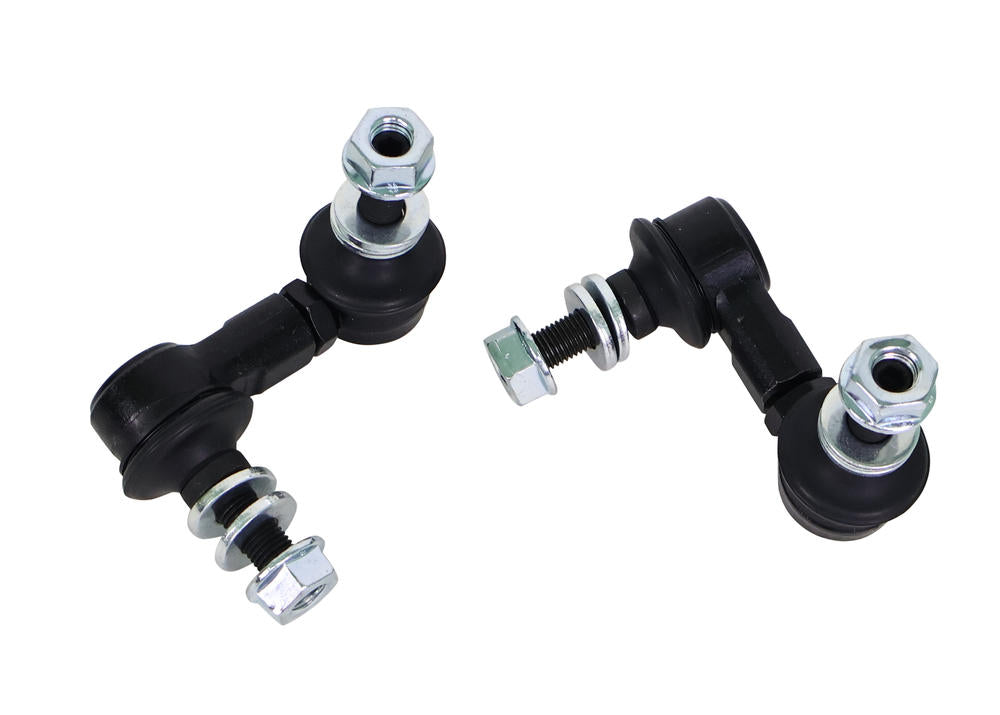 Two black metal control arms with silver bolts on a white background