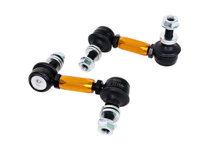 Automotive control arm assembly with orange accents on a white background