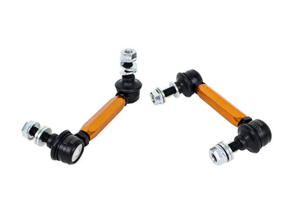 Two metal suspension control arms on a white background