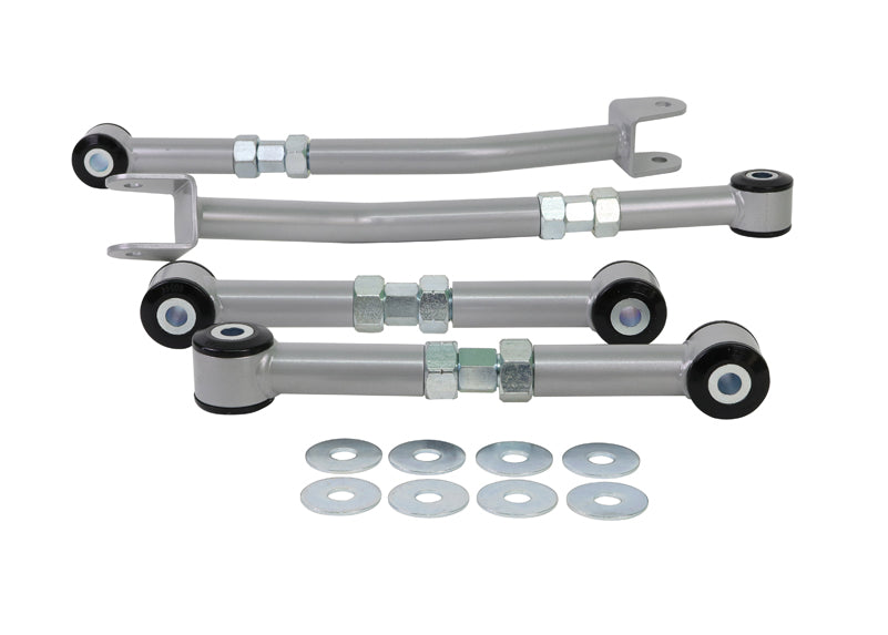 Set of suspension control arms with mounting hardware on a white background