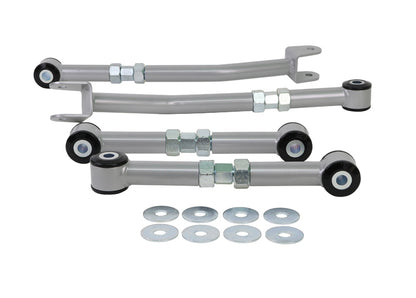 Set of suspension control arms with mounting hardware on a white background