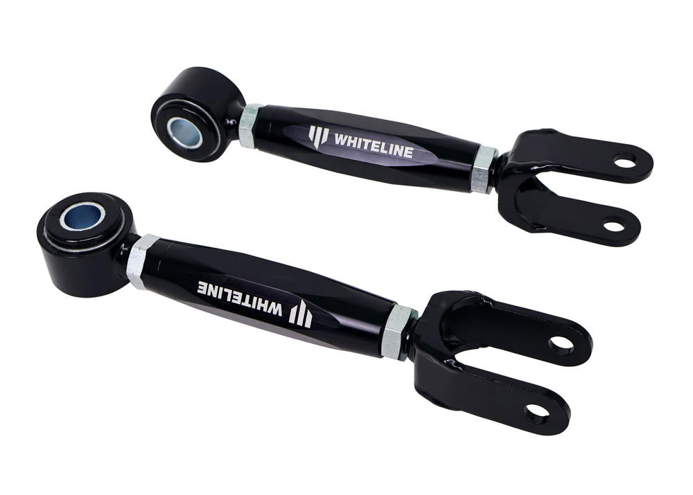 Two black Whiteline suspension links on a white background