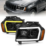 ANZO 2005-2007 Jeep Grand Cherokee Projector Headlights w/ Light Bar Switchback Black Housing