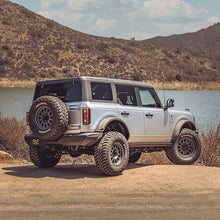 Load image into Gallery viewer, MagnaFlow 2021 Ford Bronco 2.3L I-4 Axle-Back Exhaust w/ Dual Split Rear Style Exit- Black Tips - eliteracefab.com