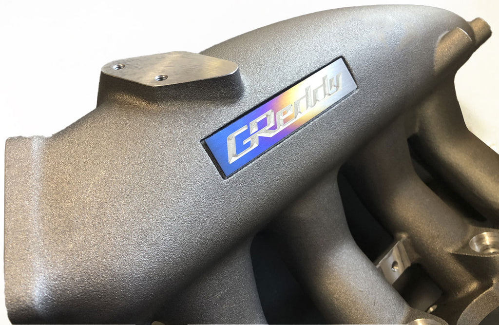 Greddy Large "Burnt Ti" Titanium Logo Emblem - eliteracefab.com