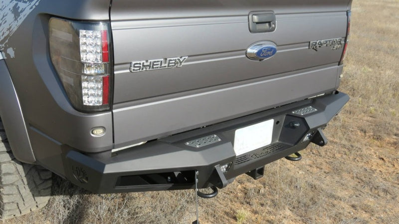 Addictive Desert Designs 10-14 Ford F-150 Raptor HoneyBadger Rear Bumper w/ Tow Hooks - eliteracefab.com