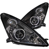 ANZO USA Toyota Celica Projector Headlights W/ Halo Black; 2000-2005