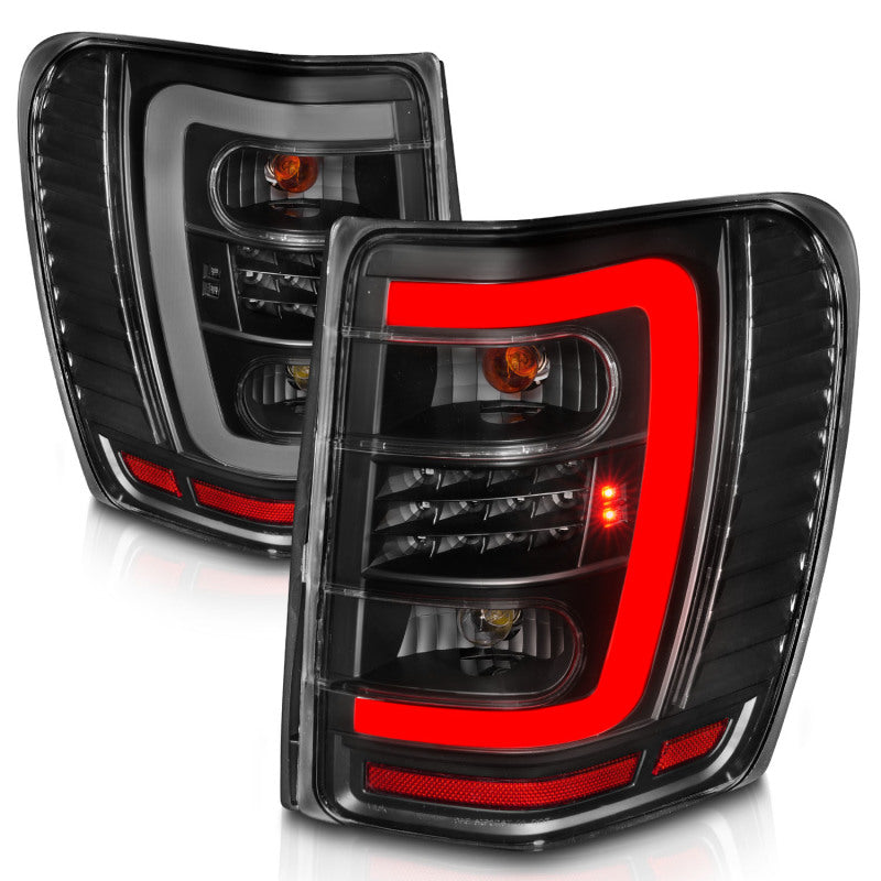 ANZO 1999-2004 Jeep Grand Cherokee LED Tail Lights w/ Light Bar Black Housing Clear Lens - eliteracefab.com