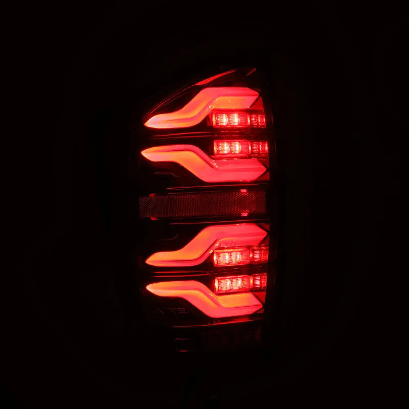 AlphaRex 16-21 Toyota Tacoma LUXX LED Taillights Alpha Blk w/Activ Light/Seq Signal - eliteracefab.com